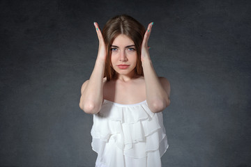 Fatigue, pain, indifference concept. She closed ears with her ha