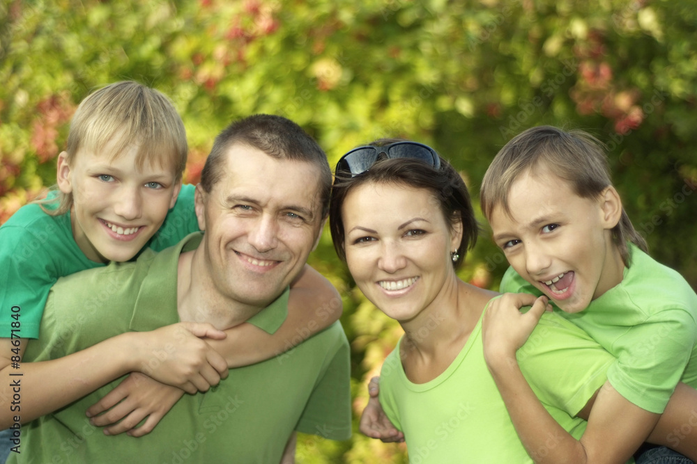 Poster friendly family in green shirts