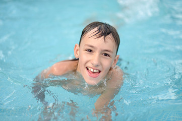 Fototapeta na wymiar Teenage boy in pool