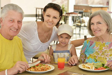 Happy family at breakfast