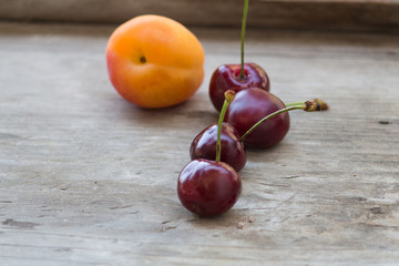 apricots and cherries on wood table