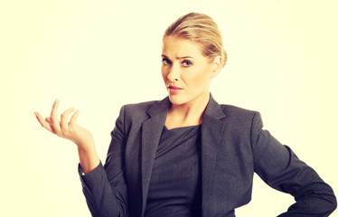 Confused woman showing irritate gesture