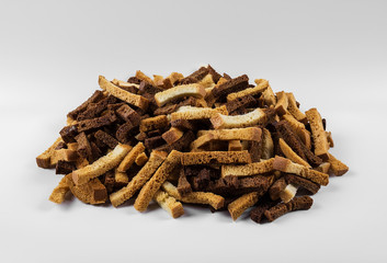  rye crackers and white bread on a grey background