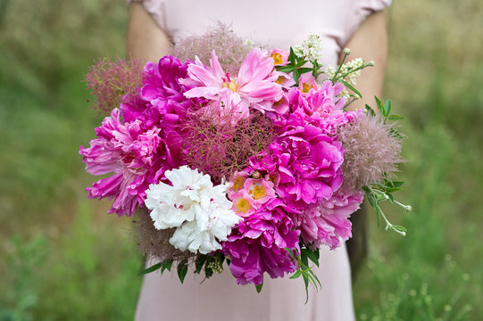 Fototapeta Bouquet in hands. Bride's bouquet