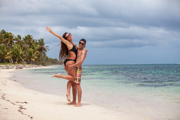 Beach couple walking on romantic travel.