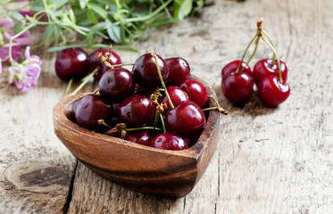 Fresh  cherries in a wooden bowl in the shape of a heart, select