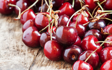 Fresh cherries on wooden table, selective focus