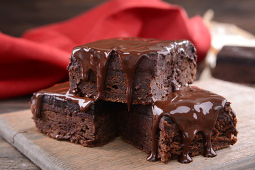 Delicious chocolate cakes on table close-up