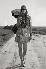 Romantic girl travelling with her guitar