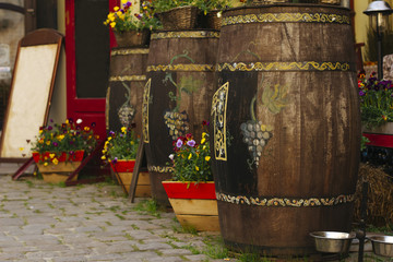 Wooden flower pots near a sidewalk cafe