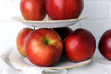 Tasty ripe apples on serving tray close up