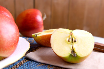 Tasty ripe apples on table close up