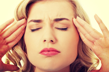 Fototapeta premium Portrait of young woman with huge headache