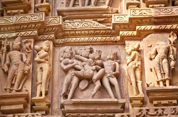 Ancient bas-relief at temple in Khajuraho, India