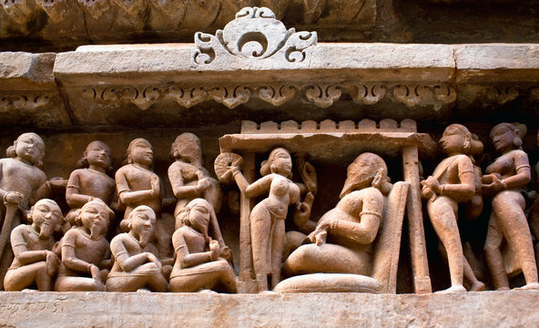 Ancient bas-relief at the famous erotic temple in Khajuraho, India