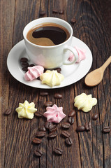 Coffee with colorful meringue cookies