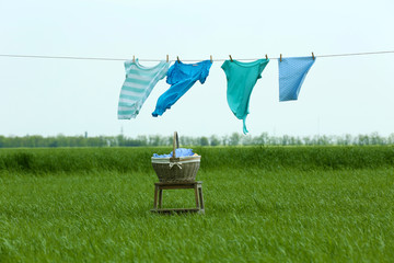 Laundry line with clothes in field