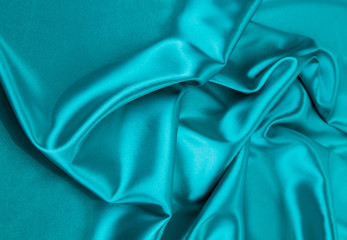 Blue silk cloth texture close up.