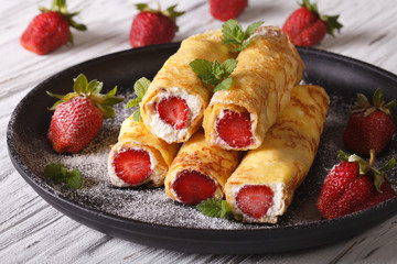Rolls with strawberry and cream cheese close-up. Horizontal
