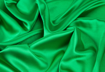 Green silk cloth with some soft folds.