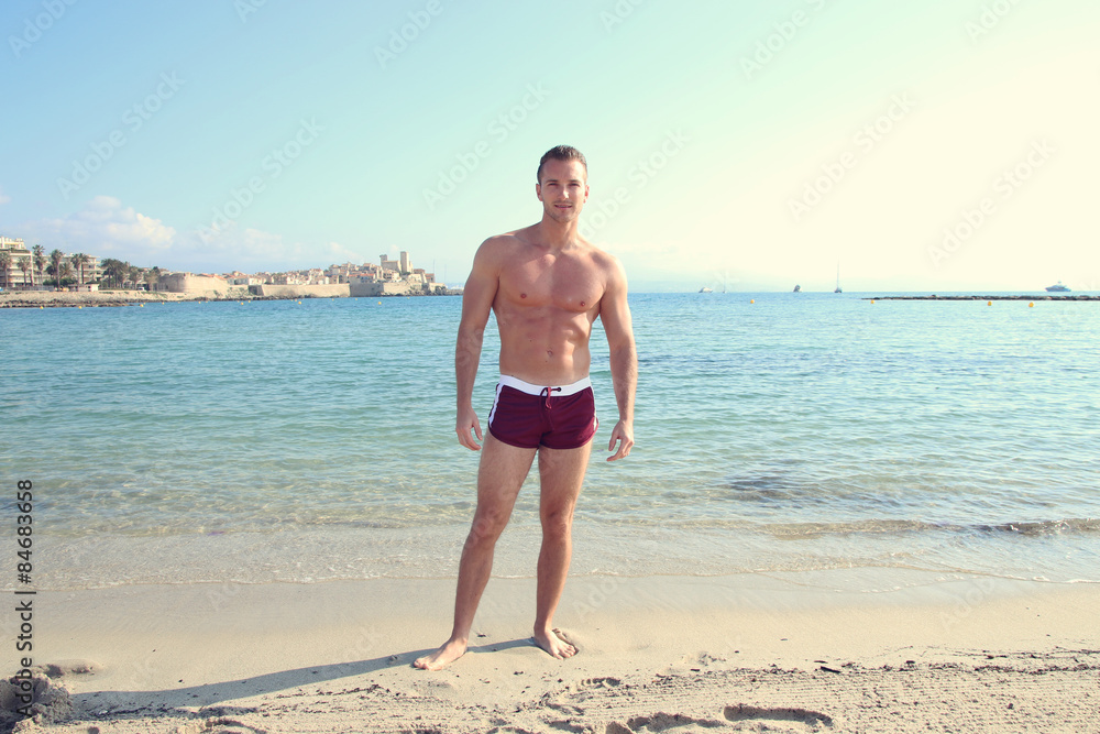 Wall mural handsome male wearing a swimsuit