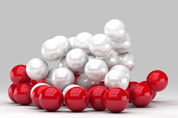 Lots of white and red balls interact. 3D render image. © marinv