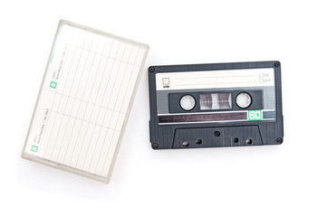 Old audio cassette on white background