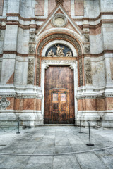 Fototapeta na wymiar wooden door in San Petronio cathedral in Bologna