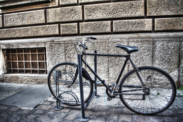 bicycle in a bike rack in Bologna