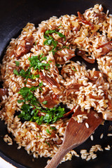 risotto with mushrooms in pan