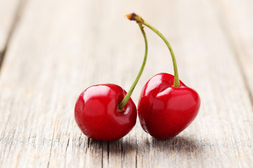 Sweet cherry on grey wooden background