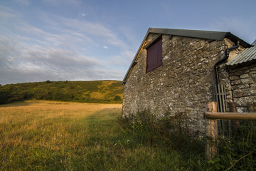 old stone barn loft in field
