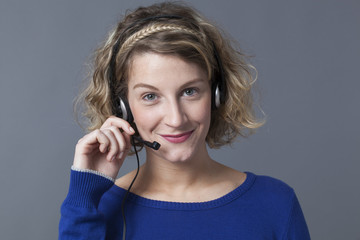 smiling female representative working as service operator on the phone