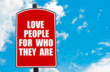 Love People For Who They Are written on road sign