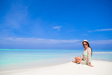 Fototapeta na wymiar Young happy woman enjoy tropical beach vacation