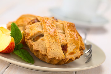 Small round apple pie with lattice crust