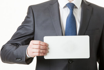 Unrecognizable businessman holding an empty paper card