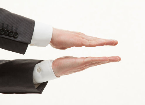 Businesman's palms showing small size