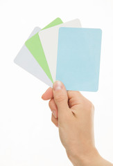 Female hand holding colorful paper cards