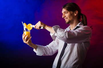 Young man bartender preparing alcohol cocktail drink