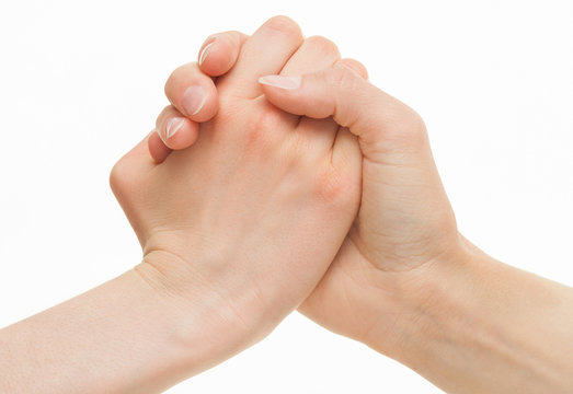 Human hands demonstrating a gesture of a strife or solidarity