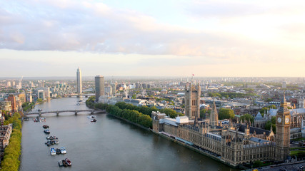 Beautiful panoramic scenic view on London's southern part from window of London Eye tourist attraction wheel cabin: cityscape, Westminster Abbey, Big Ben, Houses of Parliament and Thames river