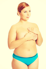 Naklejka premium Fat woman covering her breast