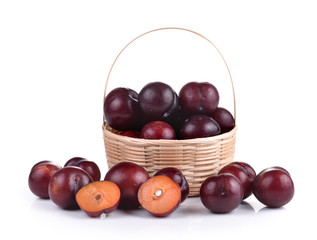 Sweet ripe cherry in the basket on white background