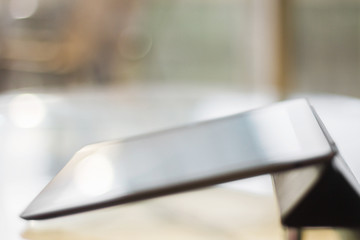 digital tablet on a glass table