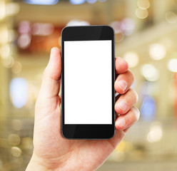 hand with empty cell phone on blurred background