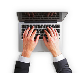 Man hands on a laptop keyboard isolated