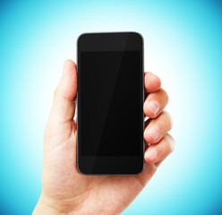 hand with empty cell phone on blue background