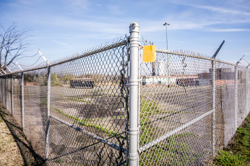 Fototapeta premium chainlink fence securing perimeter of property