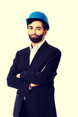 Handsome engineer in protective helmet.